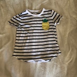Black and white striped shirt with pineapple.